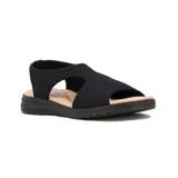Sandalias Comfortflex de suela baja color negro con capellada de tejido elástico y plantilla en tono tostado.