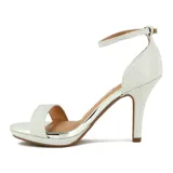 Sandalia de tacón alto Vizzano, color dorado con acabado brillante/glitter. Presenta una tira ancha en la parte delantera y una tira fina ajustable alrededor del tobillo. Tiene plataforma delantera.