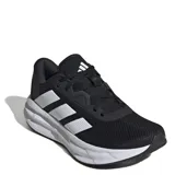 Championes de running Adidas Galaxy 7 W, color negro con las icónicas tres tiras laterales en blanco y suela con tecnología Cloudfoam para mayor amortiguación.