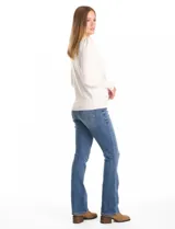 Buzo de punto liviano color blanco, con cuello redondo y mangas largas con frunce en la copa. Presenta apliques de strass en forma de destellos distribuidos en el frente. Cuenta con puños y cintura en tejido acanalado.