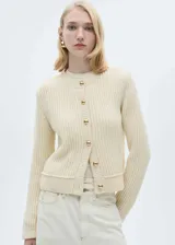 Chaqueta de punto de diseño recto y cuello redondo, con cierre frontal de botones dorados efecto joya y manga larga.