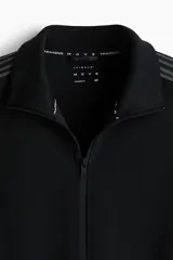 Campera deportiva negra de tejido funcional efecto neopreno con tecnología DryMove. Presenta cuello elevado, cierre bidireccional, bolsillos laterales y franjas grises en las mangas.