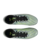 Championes de fútbol Under Armour Magnetico Select 4 FG, color verde grisáceo con detalles en amarillo neón y negro. Presentan una parte superior de piel sintética con estampado 3D para mayor control, cuello textil tipo calcetín y suela de TPU con tacos cónicos para tracción en césped natural.