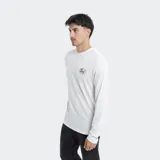 Remera de manga larga color gris, con cuello redondo y pequeño logo de la marca Reef estampado en color amarillo sobre el pecho.