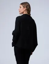 Cardigan de tejido suave con frente abierto y mangas amplias de corte holgado.