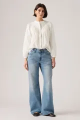 Pantalón de jean con corte bootcut y ajuste holgado, de tiro medio y lavado azul claro con efecto desgastado.