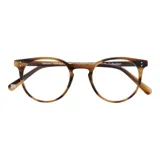 Lentes de receta con armazón de eco acetato en tono carey con acabado veteado y diseño redondeado.