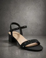 Sandalias de taco ancho medio con tiras finas cubiertas de strass brillante. Presenta una tira frontal y una tira ajustable en el tobillo, con plantilla acolchada para mayor confort.