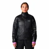 Campera acolchada de mujer Mountain Hardwear, color negro, con cierre frontal, cuello alto, bolsillo en el pecho y puños elásticos con detalle en color lila.