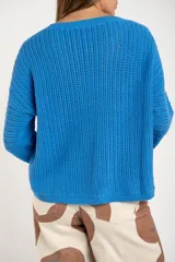 Sweater celeste de tejido de punto calado con lurex, de corte holgado y mangas largas.