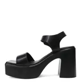 Sandalias de tacón alto y plataforma con diseño de tira ancha en la parte delantera y tira en el tobillo con hebilla metálica. Modelo Miss Carol Rivex.