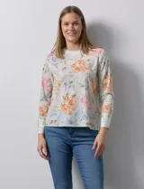 Blusa de gasa estampada con flores, marca Sioni. Manga larga con terminación de puño y botón.