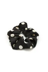Colero para el pelo de tela satinada negra con estampado de lunares blancos.