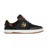 Championes de skate Etnies Marana X Independent, color negro con detalles en dorado y suela blanca. Presentan el logo de Etnies en el lateral y la leyenda "Time to Grind" en el talón.