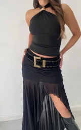 Falda larga de tul negra con short tipo boxer debajo. Cintura elastizada y corte asimétrico.