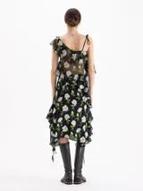 Top asimétrico de seda con estampado floral, bretel para anudar en un hombro, manga fluida y volados en el escote y laterales.