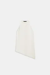 Top de Zara Woman Collection color blanco, confeccionado con mezcla de lino, con cuello redondo, espalda nadadora y diseño de bajo asimétrico.