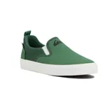Zapatillas tipo slip-on Quiksilver modelo Shore, color verde con suela blanca de goma y elásticos laterales blancos. Presenta el logo de la marca estampado en negro en la parte superior.