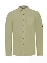 Camisa de manga larga color verde sage, confeccionada en popelina de algodón orgánico. Presenta cuello camisero, cierre frontal con botones de madera, bolsillo en el pecho con logo bordado y mangas ajustables con botones.