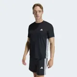 Remera deportiva Adidas de entrenamiento, color negro, con cuello redondo y mangas cortas. Presenta las icónicas tres rayas blancas de la marca en los laterales y el logo de Adidas en el pecho. Confeccionada en tejido técnico transpirable con tecnología Climacool.