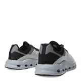 Championes deportivos unisex con diseño moderno, capellada de malla blanca y refuerzos en tono verde agua. Presentan una mediasuela voluminosa de color celeste con orificios laterales para mayor amortiguación y suela negra.