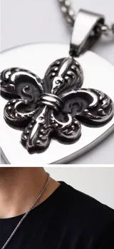 Collar de acero con cadena de eslabones trenzados y dije en forma de púa con diseño de flor de lis en relieve.