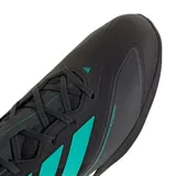 Championes de automovilismo Adidas Feroza Base, color negro con las icónicas tres tiras en color turquesa. Presenta detalles de la escudería Mercedes-AMG Petronas en el talón y suela de perfil bajo.