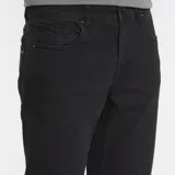 Pantalón jean Volcom modelo Solver Denim, de corte recto y color negro, confeccionado con tejido elástico.