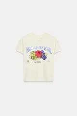 Camiseta de algodón flamé color blanco off-white, con cuello redondo, manga corta y estampado frontal vintage de Fruit of the Loom.