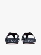 Ojotas de hombre color azul marino con suela de EVA. Las tiras son de tejido trenzado con franjas blancas y el logo de Tommy Hilfiger estampado en el centro.