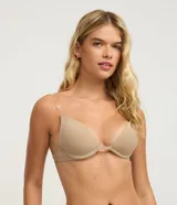 Sostén color nude de microfibra, modelo media taza con copas estructuradas y base reforzada. Cuenta con tirantes ajustables transparentes y cierre posterior.