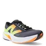 Championes New Balance Rebel V4, color gris oscuro con detalles en amarillo y naranja.