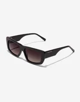 Lentes de sol Hawkers modelo Zenith con armazón de acetato negro y cristales degradados en tono ahumado.