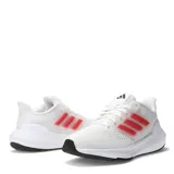 Championes de running Adidas modelo Ultra Bounce, color blanco con detalles en rosa en los laterales y suela negra. Presentan un diseño de malla transpirable y cierre con cordones.