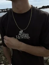 Conjunto de joyería compuesto por una cadena tipo soga y una pulsera a juego, ambos en color dorado.