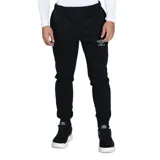Pantalón de jogging Umbro confeccionado en felpa, con corte ajustado, puños elásticos en los tobillos y logo de la marca bordado en la pierna izquierda.