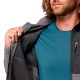 Campera cortaviento Columbia modelo Ascender, confeccionada en tejido softshell con tecnología Omni-Shield repelente al agua. Presenta diseño bicolor en tonos gris y grafito, cuello alto con protector de mentón, cierre frontal completo, bolsillos laterales y en el pecho con cremallera, y puños ajustables.