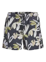 Short de baño con estampado floral abstracto en tonos verdes, beige y blancos sobre base gris oscuro. Presenta cintura elástica con cordón ajustable y bolsillos laterales.