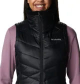 Chaleco acolchado Columbia en color negro, con cierre frontal completo, cuello alto forrado en vellón y bolsillos laterales con cierre. Presenta tecnología Omni-Shield que repele la humedad y aislamiento térmico sintético.