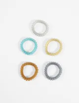 Set de cinco gomitas de pelo elásticas en espiral de colores: gris, celeste, amarillo, marrón y gris oscuro.