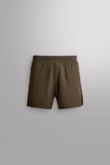 Short de entrenamiento Zara Athleticz, color marrón, confeccionado en tejido técnico ligero y elástico con estructura y tecnología Quick Dry. Cuenta con cintura elástica, aberturas laterales en las perneras y logo estampado.