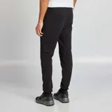Pantalón de jogging negro de punto con cintura elástica y cordón ajustable.