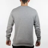 Buzo gris de Lotto de cuello redondo con logo pequeño estampado en el pecho.