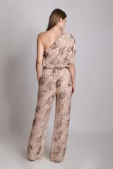 Pantalón palazzo de tiro alto con cintura elástica y cordones ajustables. Estampado floral en tonos blanco y negro.