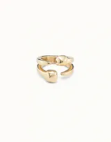 Anillo abierto plateado con dos pequeñas cabezas de clavo.