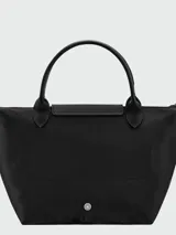 Cartera de mano modelo Le Pliage One tamaño S, confeccionada en nylon negro con detalles en cuero. Presenta cierre superior con solapa y botón a presión característico de la marca.