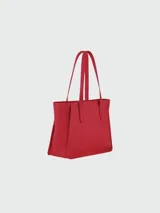 Cartera tipo tote de cuero negro con textura granulada, diseño minimalista, asas largas para hombro y compartimento principal amplio.