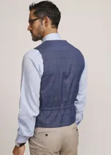 Chaleco reversible Due Volti de corte sastrero, con diseño a cuadros en tonos de gris y cierre frontal con cuatro botones oscuros.