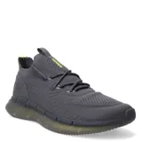 Championes Topper Styl color gris con detalles en amarillo flúor. Capellada de tejido knit con cordones y suela de goma con tecnología de amortiguación.