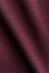 Top de tejido suave con efecto neopreno, escote en V y diseño de cintura entallada. Presenta hombros caídos, mangas largas y puños ajustados.